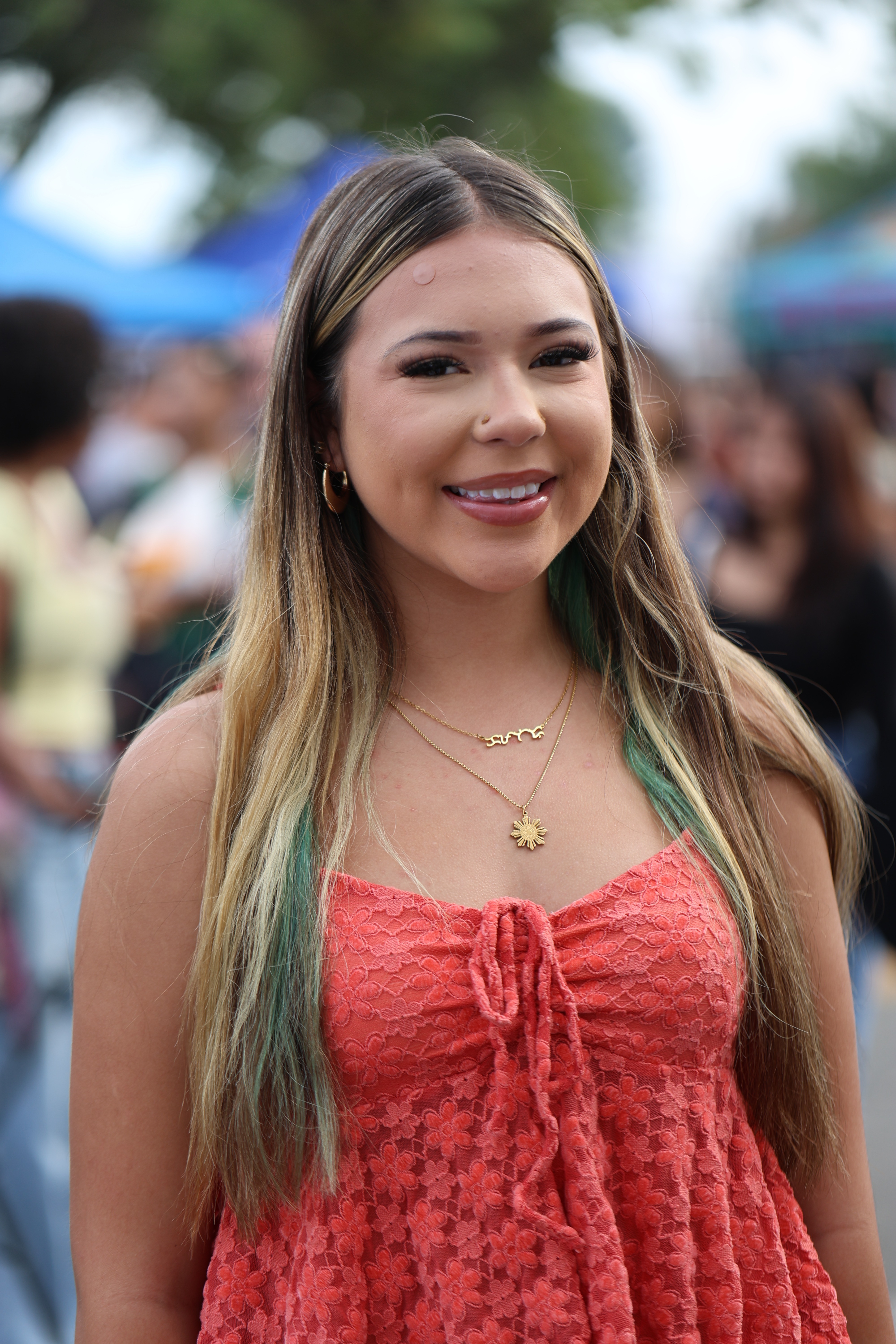 Young woman wearing the gold Mayari Nose Stud and gold Diwa Tribal Necklace from Philippine Weekend in Delano