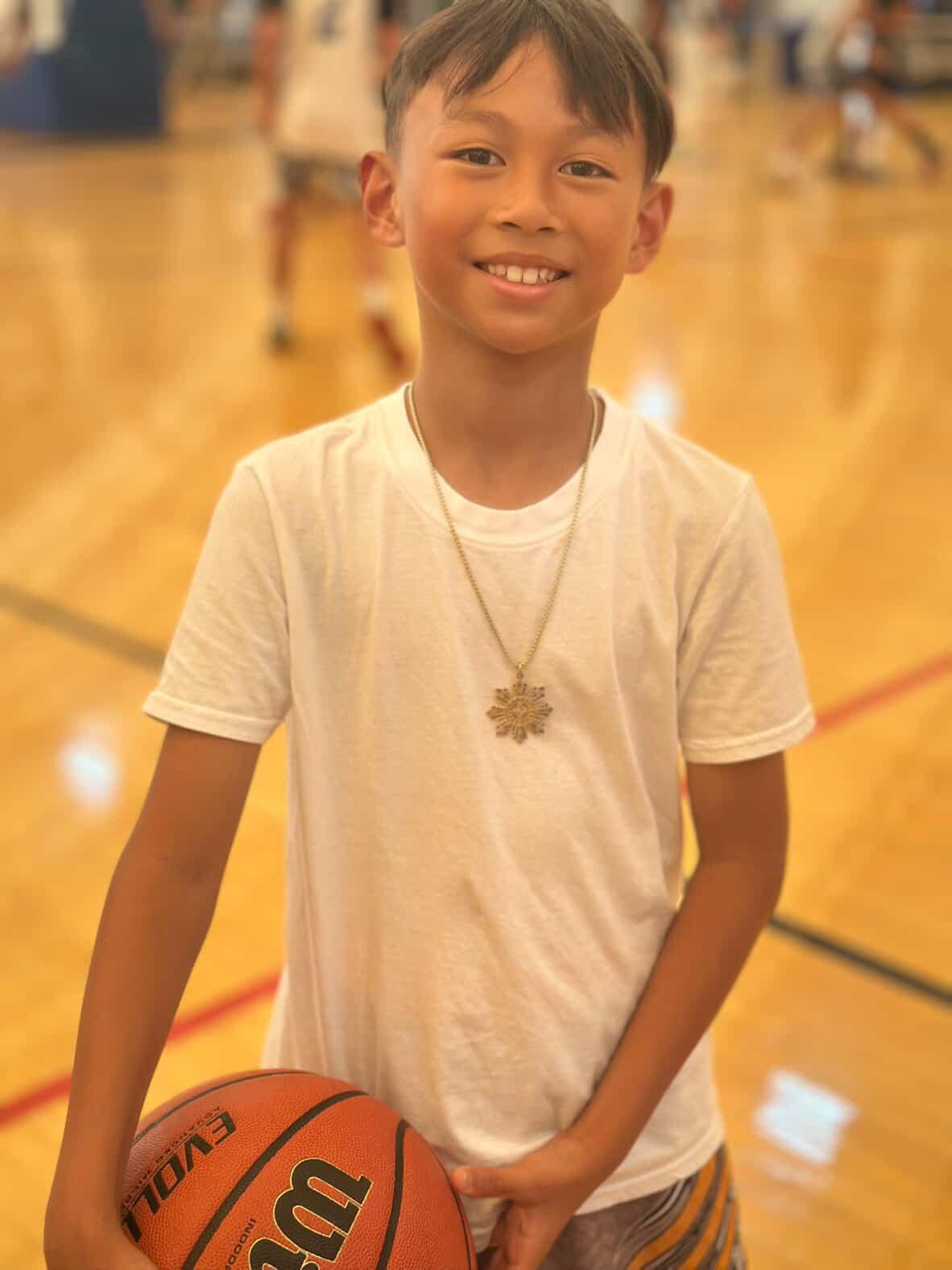 Anthony wearing the gold Lakas Tribal Necklace before his basketball game