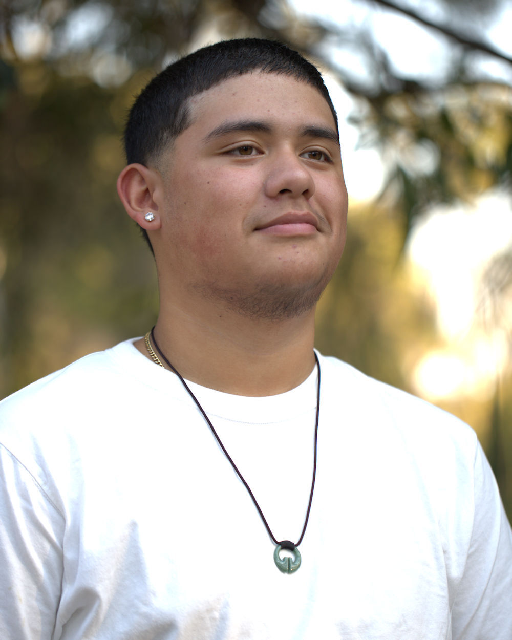 Young man wearing the Jade Kalinga Ling-Ling-O Necklace for our photoshoot