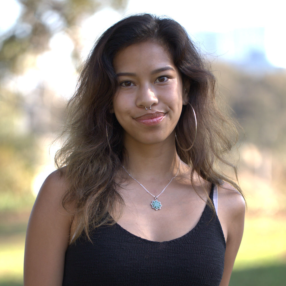 Young woman wearing the sterling silver Liwanag Jade Necklace at Sama Fest in Balboa Park